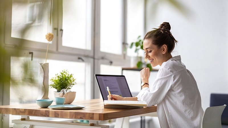 woman in yoga attire preparing to roll up a yoga mat demonstrating flexibility and focus in a relaxed environment 9 essential poses for wellness